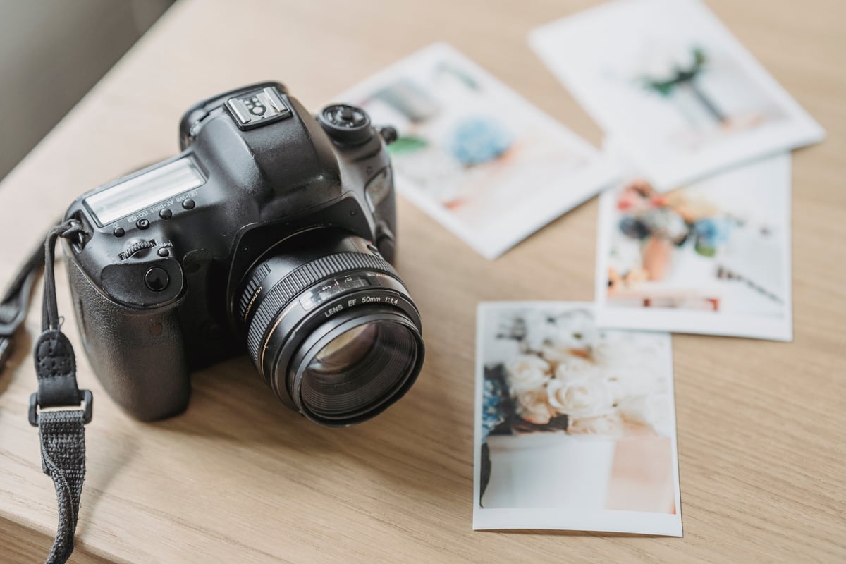 Photo camera with printed photos